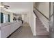 Open-concept living space with hardwood floors and modern staircase at 394 Flyway Rd, Goose Creek, SC 29445