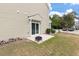 Townhome backyard patio with a fire pit and a view of street at 394 Flyway Rd, Goose Creek, SC 29445