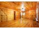 Wood paneled bedroom featuring beautiful hardwood floors and multiple closets at 398 W Fisher Rd, Summerville, SC 29483