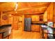 Cozy kitchen featuring stainless steel appliances, granite countertops, and wood paneled walls at 398 W Fisher Rd, Summerville, SC 29483