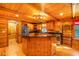 Well-equipped kitchen features custom wood cabinets, stainless appliances, and a center island at 398 W Fisher Rd, Summerville, SC 29483