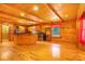 Open-concept living space with wood floors, ceilings, a kitchen, and natural light at 398 W Fisher Rd, Summerville, SC 29483