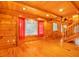 Charming living room featuring hardwood floors, wood paneled walls, and lots of natural light at 398 W Fisher Rd, Summerville, SC 29483