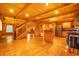 Inviting open-concept living room with wood floors, staircase, and eat-in kitchen island at 398 W Fisher Rd, Summerville, SC 29483