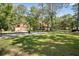 Wide view of the large yard with outbuilding, home and driveway at 398 W Fisher Rd, Summerville, SC 29483