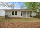 Rear exterior of home with gray vinyl siding, covered porch, and landscaping at 4013 A Ladson Rd, Ladson, SC 29456