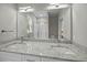 Bright bathroom features a granite countertop with double sinks and a large mirror at 4013 A Ladson Rd, Ladson, SC 29456