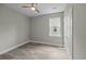 Bright bedroom featuring a ceiling fan, and a window overlooking the exterior at 4013 A Ladson Rd, Ladson, SC 29456