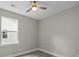 Cozy bedroom features a ceiling fan, modern windows, and neutral color palette at 4013 A Ladson Rd, Ladson, SC 29456