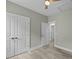 Neutral bedroom with white trim, closet and access to additional rooms at 4013 A Ladson Rd, Ladson, SC 29456