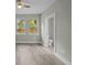 Light bedroom featuring two windows, and an ensuite bathroom at 4013 A Ladson Rd, Ladson, SC 29456