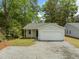 Charming single-story home featuring a one-car garage and gravel driveway at 4013 A Ladson Rd, Ladson, SC 29456