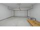 Attached garage with concrete floor and white door with an installed door opener at 4013 A Ladson Rd, Ladson, SC 29456