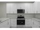 Modern kitchen featuring stainless steel appliances, granite countertops, and white cabinets at 4013 A Ladson Rd, Ladson, SC 29456