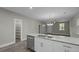 Kitchen island with stainless steel dishwasher and faucet open to living room area at 4013 A Ladson Rd, Ladson, SC 29456
