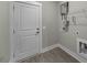 Laundry room with storage shelving, washer, dryer, and door to exit or enter at 4013 A Ladson Rd, Ladson, SC 29456