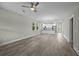 Open-concept living room and kitchen area with modern gray flooring and natural light at 4013 A Ladson Rd, Ladson, SC 29456