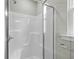 A close up view of the shower with a glass door and a built in seat at 4013 A Ladson Rd, Ladson, SC 29456