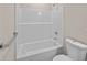 White bathroom with tub/shower and modern chrome fixtures, plus a toilet at 4013 B Ladson Rd, Ladson, SC 29456