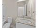 Bathroom with a white vanity featuring a granite countertop and a framed mirror at 4013 B Ladson Rd, Ladson, SC 29456