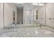 Well-lit double vanity bathroom features granite countertops, framed mirror, and glass-enclosed shower at 4013 B Ladson Rd, Ladson, SC 29456