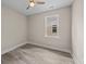 Bedroom with neutral walls, ceiling fan, and a large window providing natural light at 4013 B Ladson Rd, Ladson, SC 29456