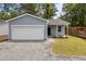Charming one-story home featuring blue siding, a one-car garage, and a gravel driveway at 4013 B Ladson Rd, Ladson, SC 29456