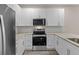 Modern kitchen with white cabinetry, granite countertops, and stainless steel appliances at 4013 B Ladson Rd, Ladson, SC 29456