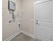 Neat laundry area featuring a modern tankless water heater and convenient shelving for storage at 4013 B Ladson Rd, Ladson, SC 29456