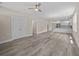 Spacious living room with gray flooring and neutral walls open to the kitchen at 4013 B Ladson Rd, Ladson, SC 29456