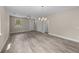 Bright and airy living room featuring gray floors and modern chandelier at 4013 B Ladson Rd, Ladson, SC 29456