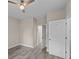 Neutral paint and light hardwood-style floors compliment this lovely bedroom with white doors at 4013 B Ladson Rd, Ladson, SC 29456