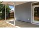 Covered patio features gray siding, white support beams, and a view of the treelined yard at 4013 B Ladson Rd, Ladson, SC 29456