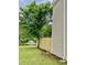 Fenced backyard with a lake view and fountain, next to the house's siding at 4114 Babbitt St, Charleston, SC 29414