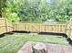 Newly fenced backyard with a picturesque view of a serene pond and fountain feature at 4114 Babbitt St, Charleston, SC 29414