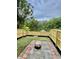 Newly fenced backyard with patio and serene pond view is perfect for entertaining at 4114 Babbitt St, Charleston, SC 29414
