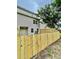 Fenced backyard showcasing the home's exterior and a neatly maintained outdoor space at 4114 Babbitt St, Charleston, SC 29414