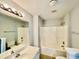 Clean bathroom featuring a sink, a mirror, and a shower-tub combo at 4114 Babbitt St, Charleston, SC 29414