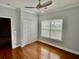 Cozy bedroom with hardwood floors, ceiling fan, and natural light from the window at 4114 Babbitt St, Charleston, SC 29414
