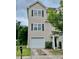 Two-story home featuring a driveway, a garage, and front lawn at 4114 Babbitt St, Charleston, SC 29414