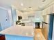 Modern kitchen with stainless steel appliances, white cabinets, and a breakfast bar at 4114 Babbitt St, Charleston, SC 29414