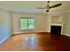 Spacious living room featuring hardwood floors, fireplace, and large window with a view at 4114 Babbitt St, Charleston, SC 29414