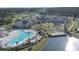 A view of community pools, clubhouse, lake, and an amphitheater for Four Seasons residents at 423 Four Seasons Blvd, Summerville, SC 29486