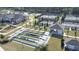 A stunning aerial view showcasing the community's bocce ball and tennis courts at 423 Four Seasons Blvd, Summerville, SC 29486