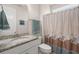Bright bathroom features a vanity with a granite countertop and a decorative shower curtain at 423 Four Seasons Blvd, Summerville, SC 29486