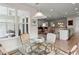 Bright dining area with glass-top table and view of the living room at 423 Four Seasons Blvd, Summerville, SC 29486