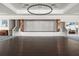 Spacious event venue with stage, piano, dark hardwood floors, and contemporary lighting at 423 Four Seasons Blvd, Summerville, SC 29486
