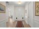 Inviting foyer with hardwood floors, elegant lighting, and easy access to living spaces at 423 Four Seasons Blvd, Summerville, SC 29486