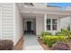 Charming front porch with walkway, potted plants, and inviting entry to the home at 423 Four Seasons Blvd, Summerville, SC 29486