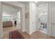 Inviting hallway with hardwood floors leads to a living area and a bathroom at 423 Four Seasons Blvd, Summerville, SC 29486